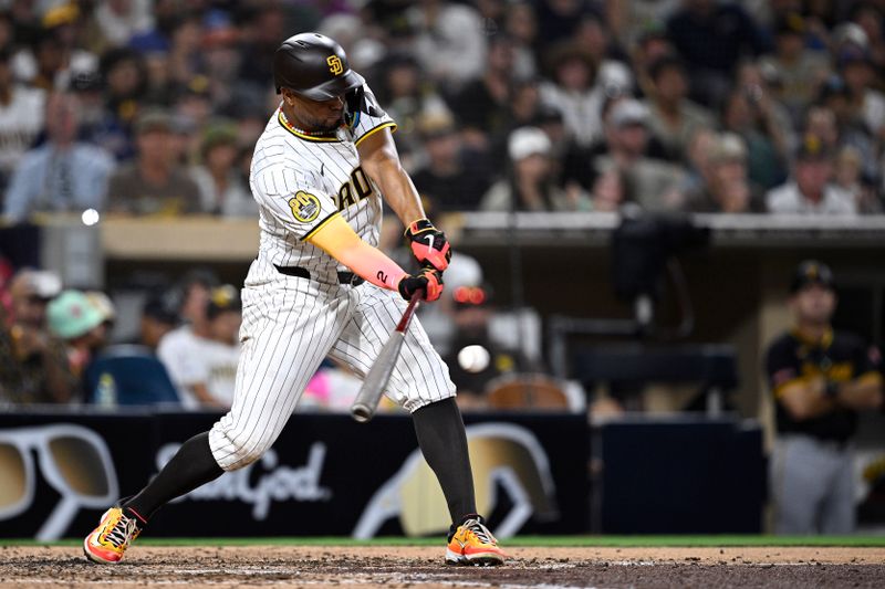 Aug 12, 2024; San Diego, California, USA; San Diego Padres second baseman Xander Bogaerts (2) hits an RBI single against the Pittsburgh Pirates during the seventh inning at Petco Park. Mandatory Credit: Orlando Ramirez-USA TODAY Sports