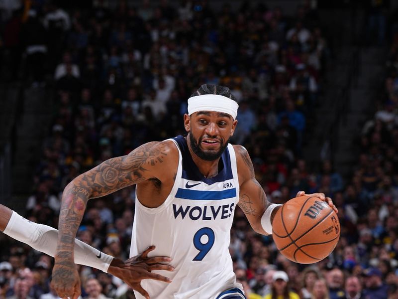 DENVER, CO - APRIL 10: Nickeil Alexander-Walker #9 of the Minnesota Timberwolves dribbles the ball during the game against the Denver Nuggets on April 10, 2024 at the Ball Arena in Denver, Colorado. NOTE TO USER: User expressly acknowledges and agrees that, by downloading and/or using this Photograph, user is consenting to the terms and conditions of the Getty Images License Agreement. Mandatory Copyright Notice: Copyright 2024 NBAE (Photo by Garrett Ellwood/NBAE via Getty Images)