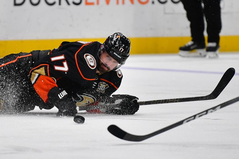 Feb 21, 2024; Anaheim, California, USA; Anaheim Ducks left wing Alex Killorn (17) falls while playing for the puck against the Columbus Blue Jackets during the third period at Honda Center. Mandatory Credit: Gary A. Vasquez-USA TODAY Sports