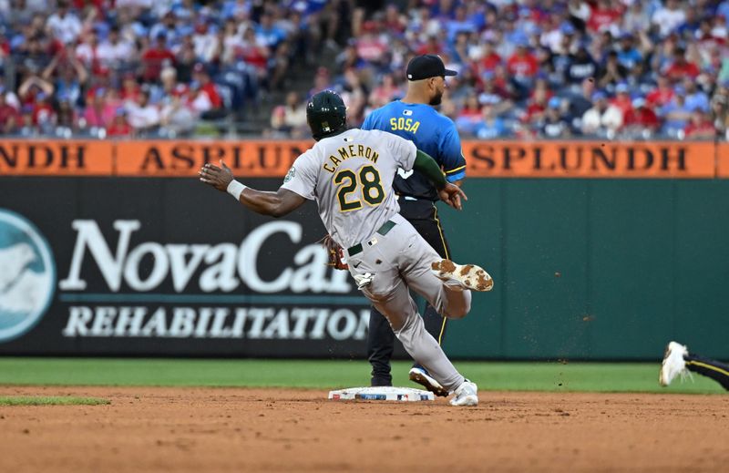 Jul 12, 2024; Philadelphia, Pennsylvania, USA; Oakland Athletics outfielder Daz Cameron (28) rounds second base and advances to third against the Philadelphia Phillies in the fifth inning at Citizens Bank Park. Mandatory Credit: Kyle Ross-USA TODAY Sports