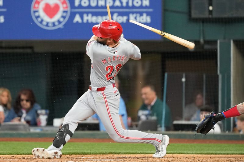 Apr 28, 2024; Arlington, Texas, USA; Cincinnati Reds designated hitter Nick Martini (23) follows through on a broken bat single against the Texas Rangers during the fifth inning at Globe Life Field. Mandatory Credit: Jim Cowsert-USA TODAY Sports