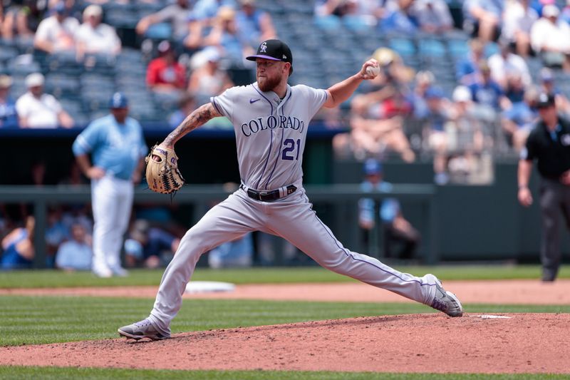 Jun 4, 2023; Kansas City, Missouri, USA; Colorado Rockies assistant hitting coach Andy Gonzalez (21) pitches during the fifth inning against the Kansas City Royalsat Kauffman Stadium. Mandatory Credit: William Purnell-USA TODAY Sports