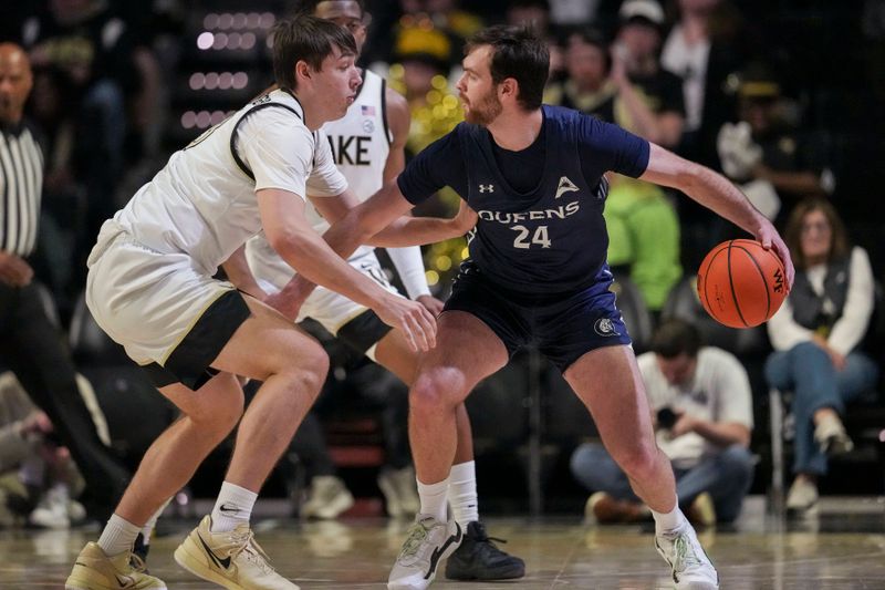 Dec 14, 2025; Winston-Salem, North Carolina, USA; Queens University Royals guard Yoav Berman (24) dribbles the ball against Wake Forest Demon Deacons forward Cooper Schwieger (13) during the first half at Lawrence Joel Veterans Memorial Coliseum. Mandatory Credit: Jim Dedmon-Imagn Images