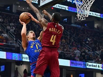 CLEVELAND, OHIO - NOVEMBER 19: Michael Porter Jr. #1 of the Denver Nuggets shoots over Evan Mobley #4 of the Cleveland Cavaliers during the first half at Rocket Mortgage Fieldhouse on November 19, 2023 in Cleveland, Ohio. NOTE TO USER: User expressly acknowledges and agrees that, by downloading and or using this photograph, User is consenting to the terms and conditions of the Getty Images License Agreement. (Photo by Jason Miller/Getty Images)