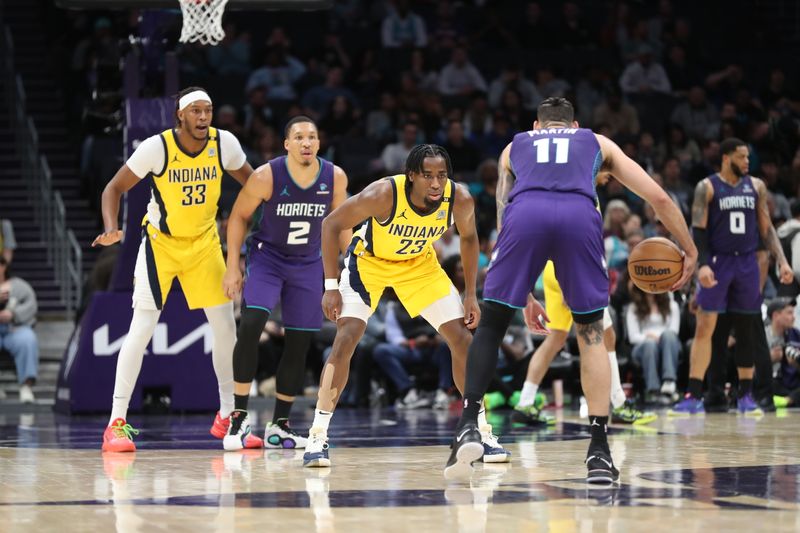 CHARLOTTE, NC - FEBRUARY 12: Aaron Nesmith #23 of the Indiana Pacers plays defense during the game against the Charlotte Hornets on February 12, 2024 at Spectrum Center in Charlotte, North Carolina. NOTE TO USER: User expressly acknowledges and agrees that, by downloading and or using this photograph, User is consenting to the terms and conditions of the Getty Images License Agreement.  Mandatory Copyright Notice:  Copyright 2024 NBAE (Photo by Brock Williams-Smith/NBAE via Getty Images)