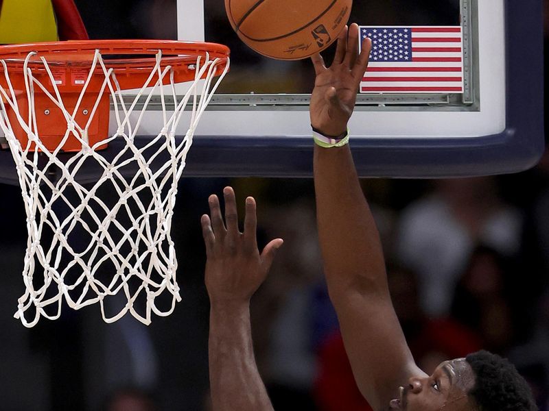 DENVER, COLORADO - JANUARY 12: Zion Williamson #1 of the New Orleans Pelicans goes to the basket against the Denver Nuggets in the first quarter at Ball Arena on January 12, 2024 in Denver, Colorado. NOTE TO USER: User expressly acknowledges and agrees that, by downloading and or using this photograph, User is consenting to the terms and conditions of the Getty Images License Agreement.  (Photo by Matthew Stockman/Getty Images)