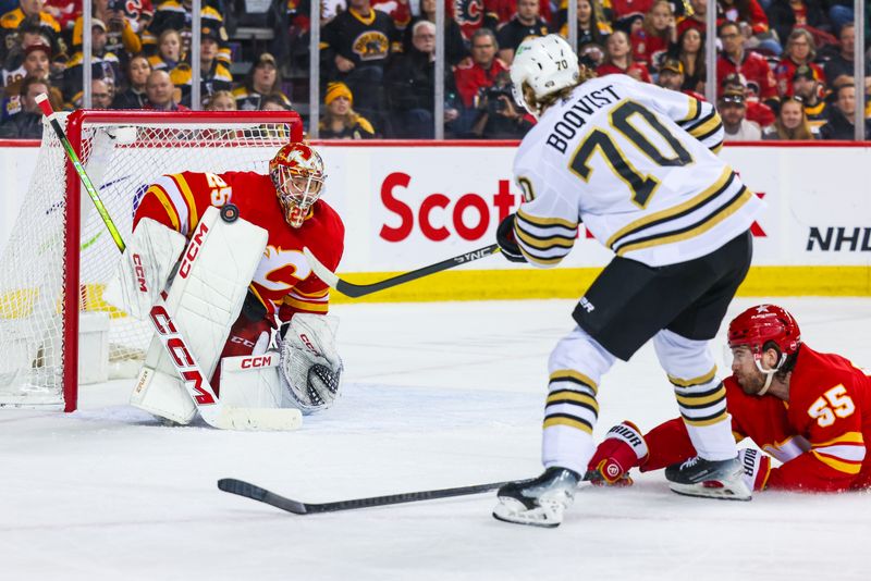 Feb 22, 2024; Calgary, Alberta, CAN; Calgary Flames goaltender Jacob Markstrom (25) makes a save against Boston Bruins goaltender Brandon Bussi (70) during the third period at Scotiabank Saddledome. Mandatory Credit: Sergei Belski-USA TODAY Sports