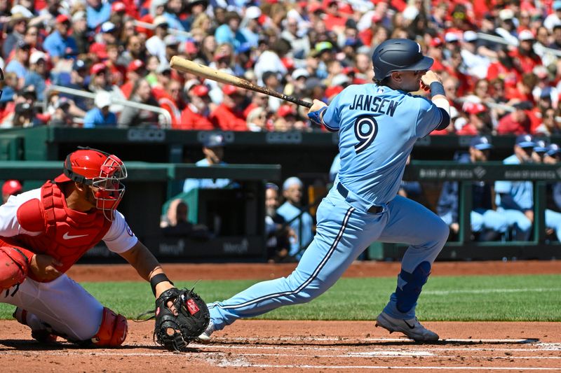 Apr 2, 2023; St. Louis, Missouri, USA;  Toronto Blue Jays catcher Danny Jansen (9) hits a one run single against the St. Louis Cardinals during the second inning at Busch Stadium. Mandatory Credit: Jeff Curry-USA TODAY Sports