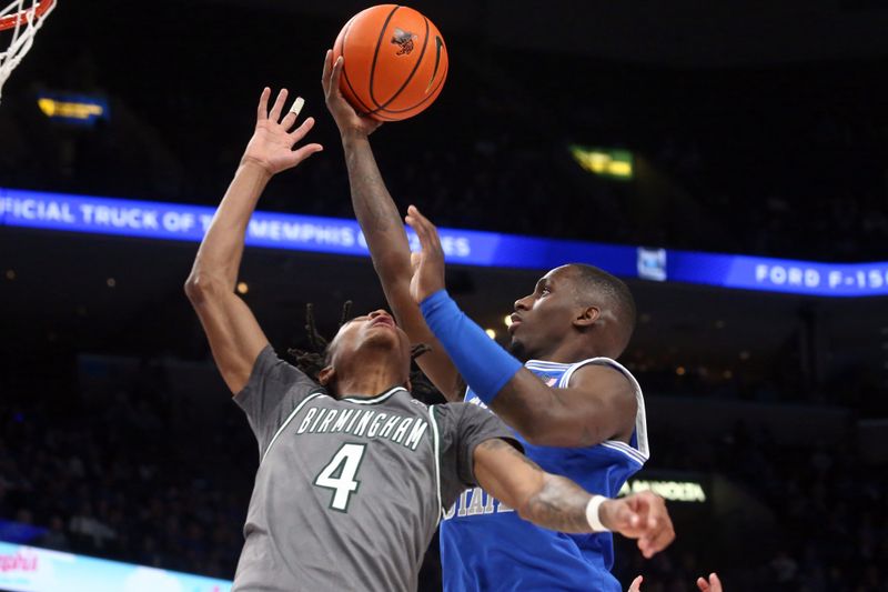 Mar 3, 2024; Memphis, Tennessee, USA; Memphis Tigers forward David Jones (8) shoots over UAB Blazers guard Eric Gaines (4) during the first half at FedExForum. Mandatory Credit: Petre Thomas-USA TODAY Sports