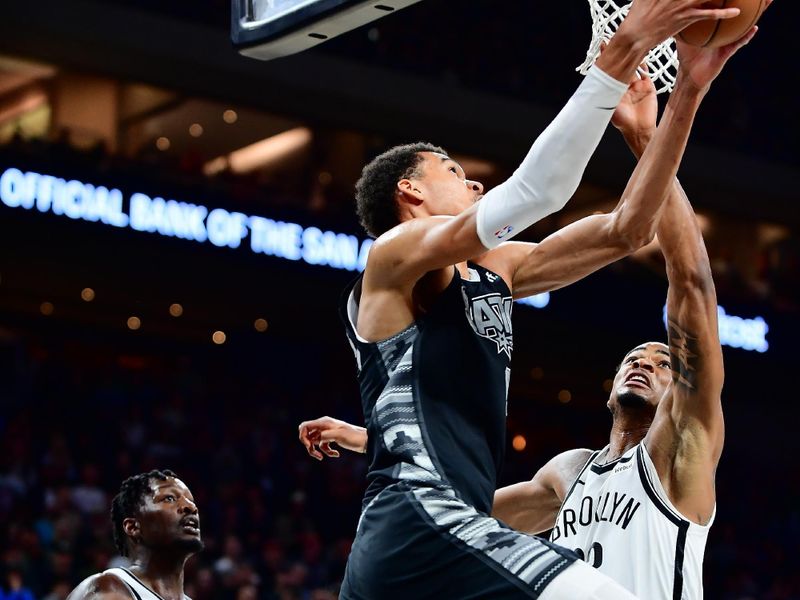 AUSTIN, TX - MARCH 17: Nicolas Claxton #33 of the Brooklyn Nets blocks the shot by Victor Wembanyama #1 of the San Antonio Spurs during overtime of the game on March 17, 2024 at the Moody Center in Austin, Texas. NOTE TO USER: User expressly acknowledges and agrees that, by downloading and or using this photograph, user is consenting to the terms and conditions of the Getty Images License Agreement. Mandatory Copyright Notice: Copyright 2024 NBAE (Photos by Michael Gonzales/NBAE via Getty Images)