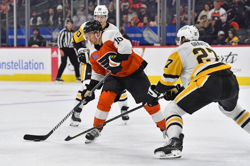 Jan 8, 2024; Philadelphia, Pennsylvania, USA; Philadelphia Flyers right wing Bobby Brink (10) is defended by Pittsburgh Penguins defenseman Ryan Graves (27) during the third period at Wells Fargo Center. Mandatory Credit: Eric Hartline-USA TODAY Sports