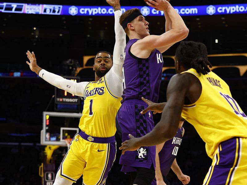 LOS ANGELES, CALIFORNIA - NOVEMBER 15:  Kevin Huerter #9 of the Sacramento Kings takes a shot against D'Angelo Russell #1 of the Los Angeles Lakers  in the second quarter at Crypto.com Arena on November 15, 2023 in Los Angeles, California.  NOTE TO USER: User expressly acknowledges and agrees that, by downloading and/or using this photograph, user is consenting to the terms and conditions of the Getty Images License Agreement. (Photo by Ronald Martinez/Getty Images)