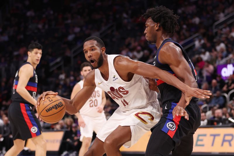 DETROIT, MICHIGAN - MARCH 01: Evan Mobley #4 of the Cleveland Cavaliers tries to drive around James Wiseman #13 of the Detroit Pistons during the first half at Little Caesars Arena on March 01, 2024 in Detroit, Michigan. NOTE TO USER: User expressly acknowledges and agrees that, by downloading and or using this photograph, User is consenting to the terms and conditions of the Getty Images License.  (Photo by Gregory Shamus/Getty Images)