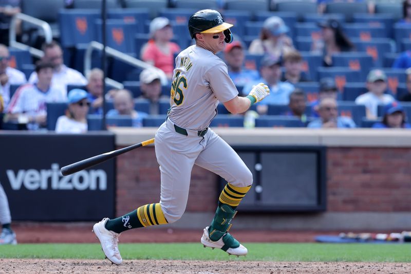 Aug 15, 2024; New York City, New York, USA; Oakland Athletics designated hitter Tyler Nevin (26) follows through on an RBI fielders choice ground out during the sixth inning against the New York Mets at Citi Field. Mandatory Credit: Brad Penner-USA TODAY Sports