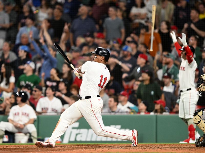 May 17, 2025; Boston, Massachusetts, USA; Boston Red Sox designated hitter Rafael Devers (11) hits a walk off home run against the Atlanta Braves during the ninth inning at Fenway Park. Mandatory Credit: Brian Fluharty-Imagn Images