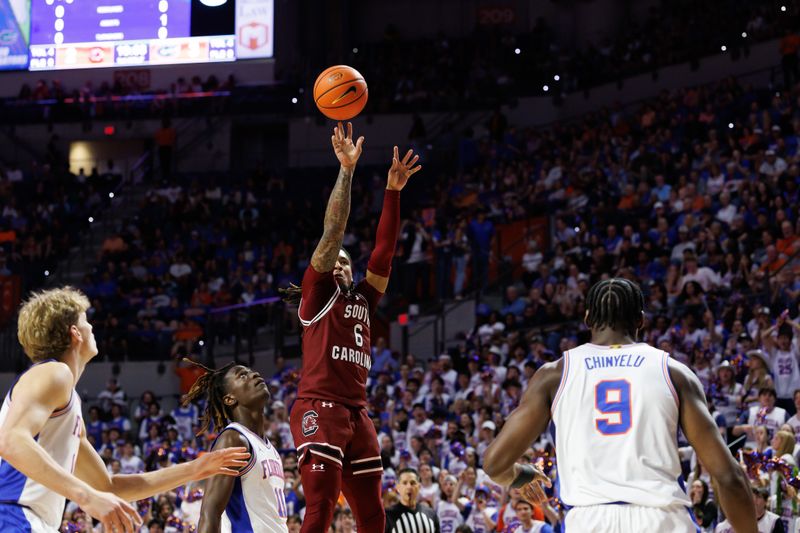 Feb 15, 2025; Gainesville, Florida, USA; South Carolina Gamecocks guard Jamarii Thomas (6) shoots the ball over Florida Gators guard Denzel Aberdeen (11) during the first half at Exactech Arena at the Stephen C. O'Connell Center. Mandatory Credit: Matt Pendleton-Imagn Images