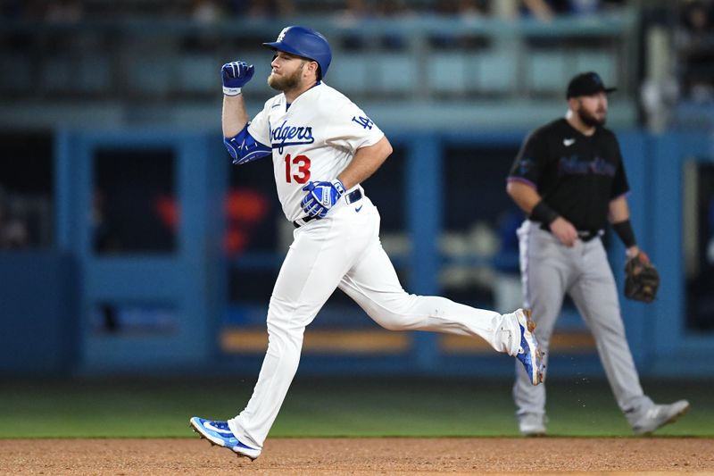 Aug 18, 2023; Los Angeles, California, USA; Los Angeles Dodgers third baseman Max Muncy (13) celebrates after hitting a home run against the Miami Marlins during the fourth inning at Dodger Stadium. Mandatory Credit: Jonathan Hui-USA TODAY Sports