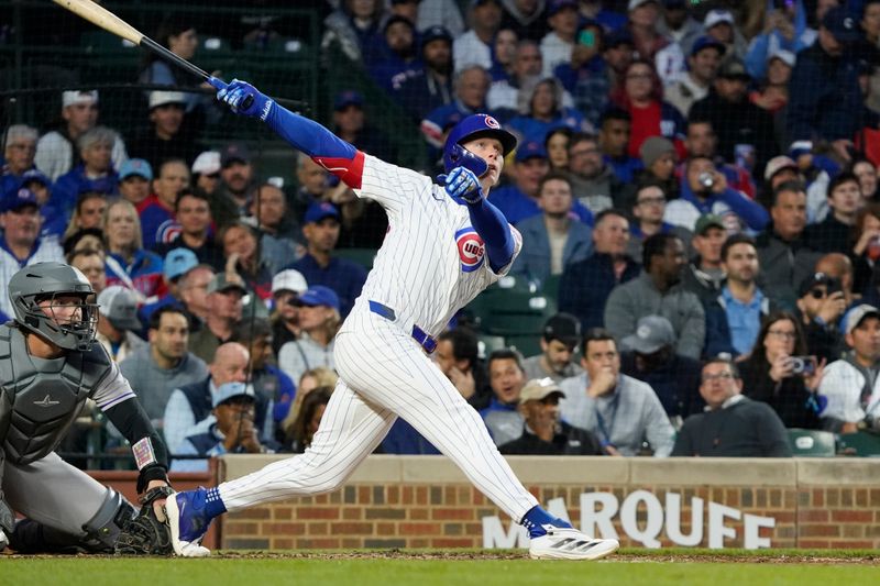 May 28, 2025; Chicago, Illinois, USA; Chicago Cubs outfielder Pete Crow-Armstrong (4) hits a home run against the Colorado Rockies during the fourth inning at Wrigley Field. Mandatory Credit: David Banks-Imagn Images