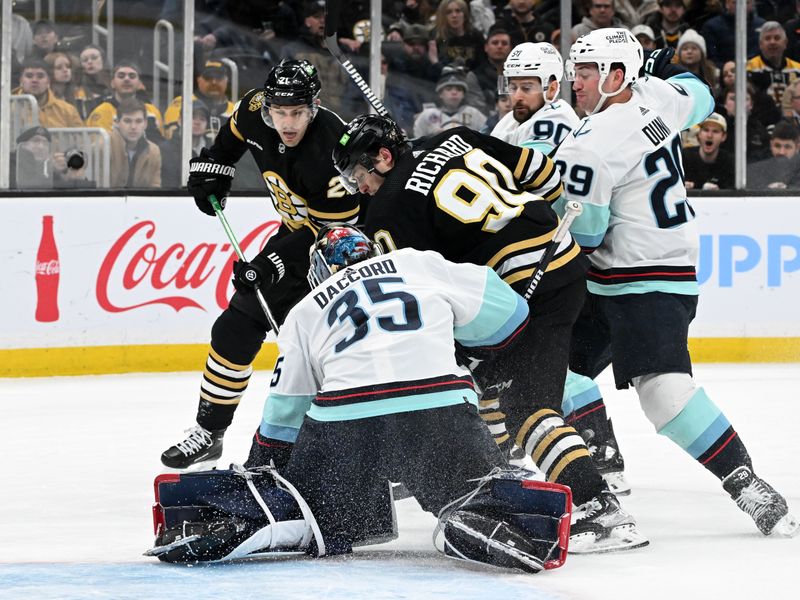 Feb 15, 2024; Boston, Massachusetts, USA; Boston Bruins center Anthony Richard (90) battles for the puck in front of Seattle Kraken goaltender Joey Daccord (35) during the first period at TD Garden. Mandatory Credit: Brian Fluharty-USA TODAY Sports