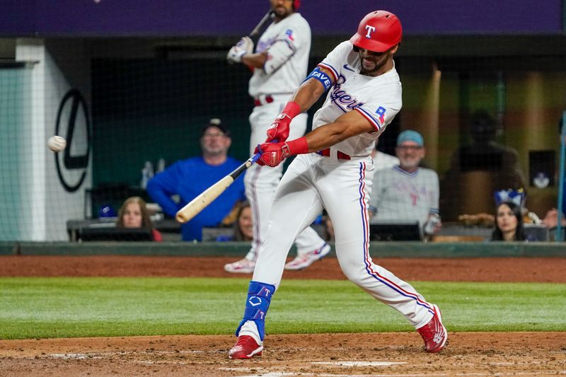 May 17, 2023; Arlington, Texas, USA; Texas Rangers center fielder Leody Taveras (3) hits a RBI single against the Atlanta Braves during the fourth inning at Globe Life Field. Mandatory Credit: Raymond Carlin III-USA TODAY Sports