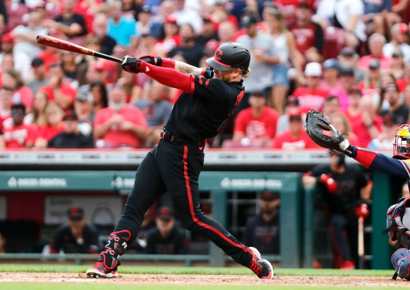 Jun 23, 2023; Cincinnati, Ohio, USA; Cincinnati Reds right fielder Jake Fraley (27) hits two-run home run against the Atlanta Braves during the second inning at Great American Ball Park. Mandatory Credit: David Kohl-USA TODAY Sports