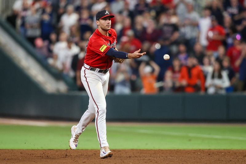 Sep 28, 2023; Atlanta, Georgia, USA; Atlanta Braves first baseman Matt Olson (28) throws a runner out at first against the Chicago Cubs in the ninth inning at Truist Park. Mandatory Credit: Brett Davis-USA TODAY Sports