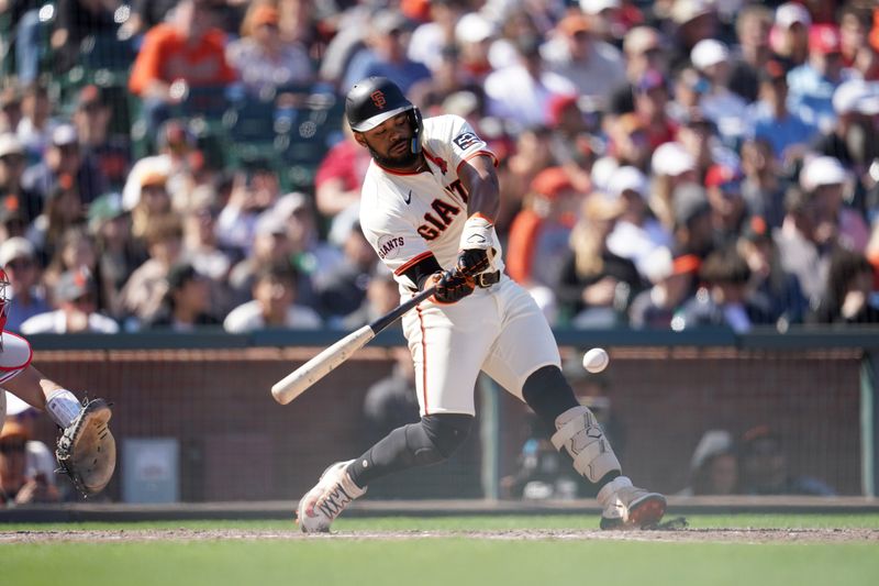 May 27, 2024; San Francisco, California, USA; San Francisco Giants left fielder Heliot Ramos (17) hits a two-run single against the Philadelphia Phillies in the seventh inning at Oracle Park. Mandatory Credit: Cary Edmondson-USA TODAY Sports