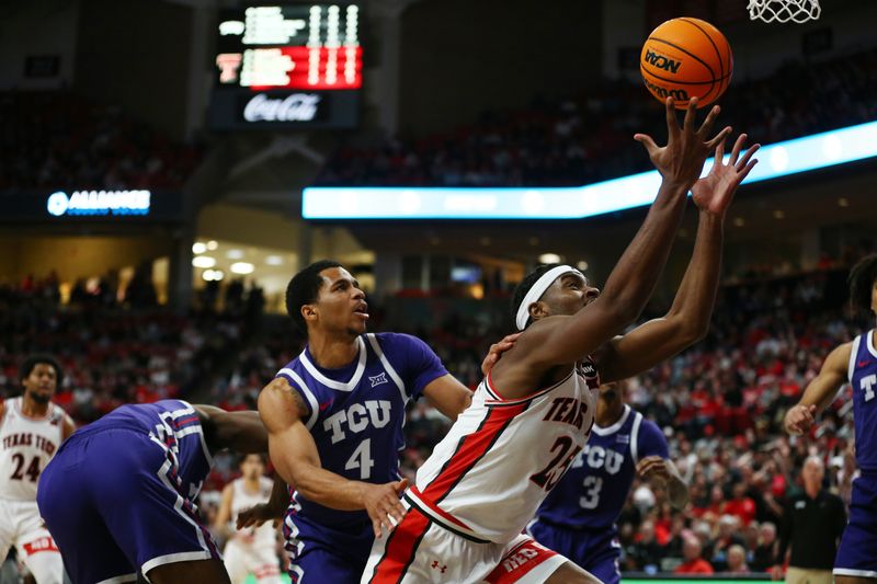 Feb 20, 2024; Lubbock, Texas, USA;  Texas Tech Red Raiders forward Robert Jennings (25) tries to grab a rebound against TCU Horned Frogs guard Jameer Nelson Jr (4) in the first half at United Supermarkets Arena. Mandatory Credit: Michael C. Johnson-USA TODAY Sports