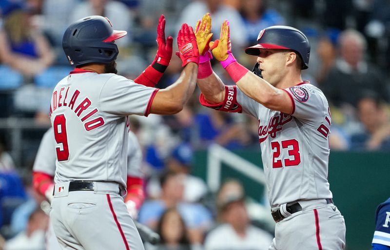 May 26, 2023; Kansas City, Missouri, USA; Washington Nationals third baseman Jeimer Candelario (9) congratulated left fielder Corey Dickerson (23) after hitting a home run during the sixth inning against the Kansas City Royals at Kauffman Stadium. Mandatory Credit: Jay Biggerstaff-USA TODAY Sports