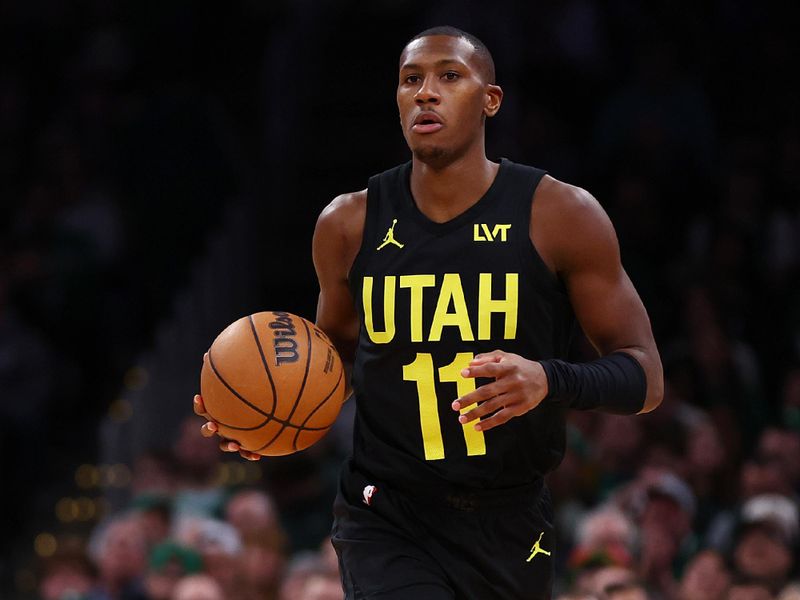 BOSTON, MASSACHUSETTS - JANUARY 05: Kris Dunn #11 of the Utah Jazz dribbles against the Boston Celtics during the fourth quarter at TD Garden on January 05, 2024 in Boston, Massachusetts. The Celtics defeat the Jazz 126-97. NOTE TO USER: User expressly acknowledges and agrees that, by downloading and or using this photograph, user is consenting to the terms and conditions of the Getty Images License Agreement.  (Photo by Maddie Meyer/Getty Images)