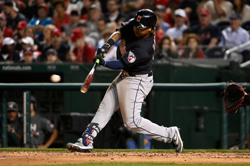 Apr 14, 2023; Washington, District of Columbia, USA; Cleveland Guardians third baseman Jose Ramirez (11) hits a single against the Washington Nationals during the sixth inning at Nationals Park. Mandatory Credit: Brad Mills-USA TODAY Sports