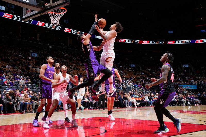 TORONTO, CANADA - OCTOBER 23: Craig Porter #9 of the Cleveland Cavaliers drives to the basket during the game against the Toronto Raptors on October 23, 2024 at the Scotiabank Arena in Toronto, Ontario, Canada.  NOTE TO USER: User expressly acknowledges and agrees that, by downloading and or using this Photograph, user is consenting to the terms and conditions of the Getty Images License Agreement.  Mandatory Copyright Notice: Copyright 2024 NBAE (Photo by Mark Blinch/NBAE via Getty Images)