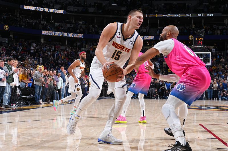 DENVER, CO - DECEMBER 14: Nikola Jokic #15 of the Denver Nuggets dribbles the ball during the game against the Washington Wizards on December 14, 2022 at the Ball Arena in Denver, Colorado. NOTE TO USER: User expressly acknowledges and agrees that, by downloading and/or using this Photograph, user is consenting to the terms and conditions of the Getty Images License Agreement. Mandatory Copyright Notice: Copyright 2022 NBAE (Photo by Bart Young/NBAE via Getty Images)