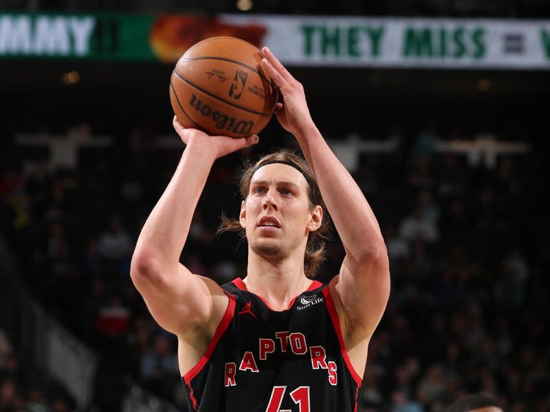 MILWAUKEE, WI - APRIL 5: Kelly Olynyk #41 of the Toronto Raptors shoots a free throw during the game against the Milwaukee Bucks on April 5, 2024 at the Fiserv Forum Center in Milwaukee, Wisconsin. NOTE TO USER: User expressly acknowledges and agrees that, by downloading and or using this Photograph, user is consenting to the terms and conditions of the Getty Images License Agreement. Mandatory Copyright Notice: Copyright 2024 NBAE (Photo by Gary Dineen/NBAE via Getty Images).