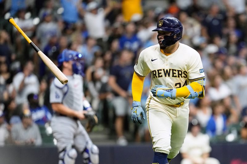 Aug 13, 2024; Milwaukee, Wisconsin, USA;  Milwaukee Brewers catcher William Contreras (24) flips his bat away after hitting a home run during the third inning against the Los Angeles Dodgers at American Family Field. Mandatory Credit: Jeff Hanisch-USA TODAY Sports