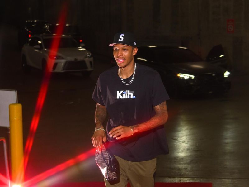 HOUSTON, TX - MARCH 14:  Jabari Smith Jr. #10 of the Houston Rockets arrives to the arena before the game against the Washington Wizards on March 14, 2024 at the Toyota Center in Houston, Texas. NOTE TO USER: User expressly acknowledges and agrees that, by downloading and or using this photograph, User is consenting to the terms and conditions of the Getty Images License Agreement. Mandatory Copyright Notice: Copyright 2024 NBAE (Photo by Logan Riely/NBAE via Getty Images)