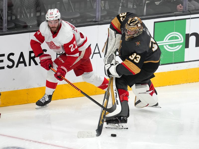 Jan 19, 2023; Las Vegas, Nevada, USA; Detroit Red Wings center Michael Rasmussen (27) centers the puck away from Vegas Golden Knights goaltender Adin Hill (33) during the third period at T-Mobile Arena. Mandatory Credit: Stephen R. Sylvanie-USA TODAY Sports