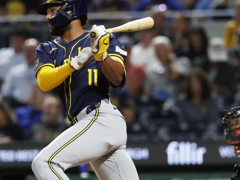 Sep 24, 2024; Pittsburgh, Pennsylvania, USA; Milwaukee Brewers left fielder Jackson Chourio (11) hits a single against the Pittsburgh Pirates during the seventh inning at PNC Park. Mandatory Credit: Charles LeClaire-Imagn Images