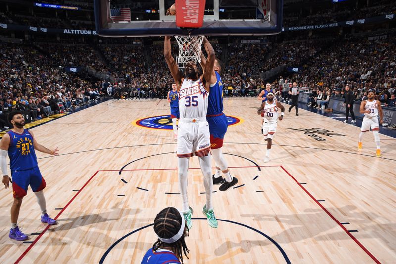 DENVER, CO - MARCH 5: Kevin Durant #35 of the Phoenix Suns dunks the ball during the game against the Denver Nuggets on March 5, 2024 at the Ball Arena in Denver, Colorado. NOTE TO USER: User expressly acknowledges and agrees that, by downloading and/or using this Photograph, user is consenting to the terms and conditions of the Getty Images License Agreement. Mandatory Copyright Notice: Copyright 2024 NBAE (Photo by Garrett Ellwood/NBAE via Getty Images)