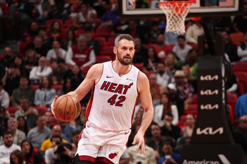 MIAMI, FL - JANUARY 31: Kevin Love #42 of the Miami Heat handles the ball during the game against the Sacramento Kings on January 31, 2024 at Kaseya Center in Miami, Florida. NOTE TO USER: User expressly acknowledges and agrees that, by downloading and or using this Photograph, user is consenting to the terms and conditions of the Getty Images License Agreement. Mandatory Copyright Notice: Copyright 2024 NBAE (Photo by Issac Baldizon/NBAE via Getty Images)