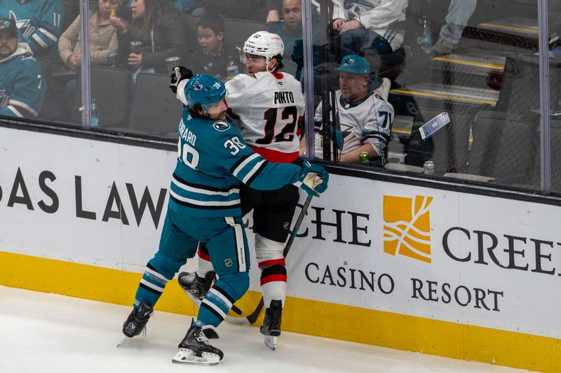 Nov 27, 2024; San Jose, California, USA; Ottawa Senators center Shane Pinto (12) is checked into the boards behind the net by San Jose Sharks defenseman Mario Ferraro (38) during the second period at SAP Center at San Jose. Mandatory Credit: Neville E. Guard-Imagn Images