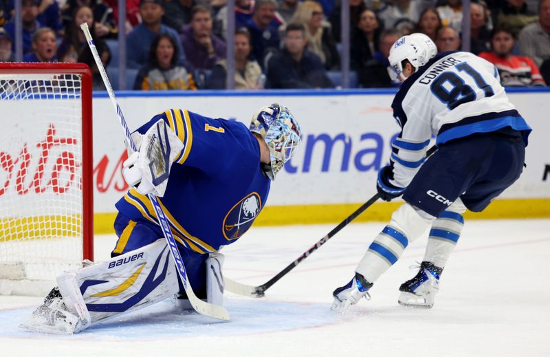 Dec 1, 2025; Buffalo, New York, USA;  Buffalo Sabres goaltender Ukko-Pekka Luukkonen (1) makes a save on Winnipeg Jets left wing Kyle Connor (81) during the third period at KeyBank Center. Mandatory Credit: Timothy T. Ludwig-Imagn Images