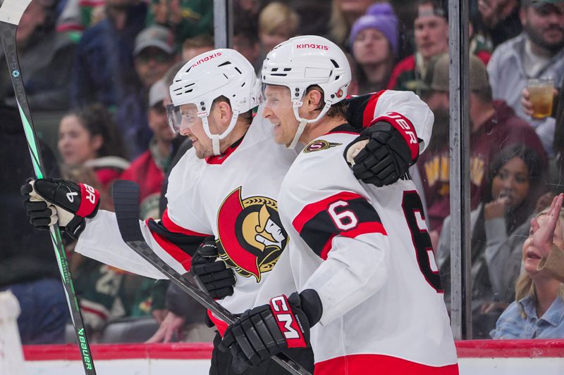 Apr 2, 2024; Saint Paul, Minnesota, USA; Ottawa Senators defenseman Jakob Chychrun (6) and right wing Drake Batherson (19) celebrate his goal against the Minnesota Wild in the third period at Xcel Energy Center. Mandatory Credit: Brad Rempel-USA TODAY Sports