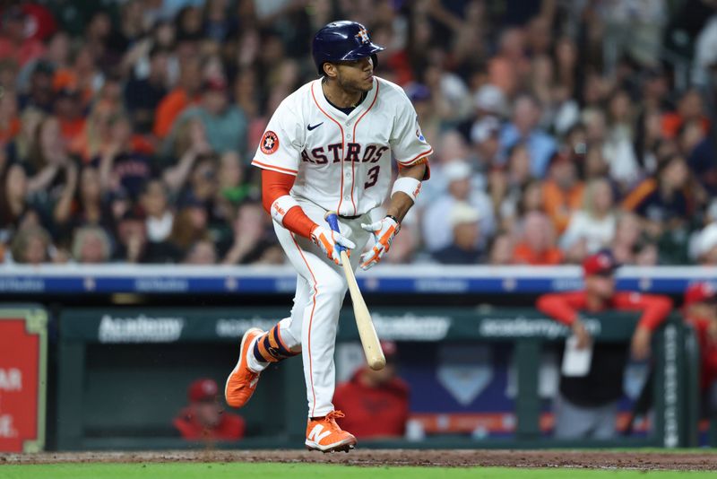 May 10, 2025; Houston, Texas, USA; Houston Astros shortstop Jeremy Pena (3) hits an RBI single during the fifth inning against the Cincinnati Reds at Daikin Park. Mandatory Credit: Troy Taormina-Imagn Images