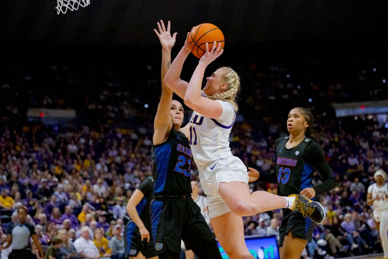 Feb 4, 2024; Baton Rouge, Louisiana, USA; LSU Lady Tigers guard Hailey Van Lith (11) shoots against Florida Gators guard Leilani Correa (23) during the first half at Pete Maravich Assembly Center. Mandatory Credit: Matthew Hinton-USA TODAY Sports