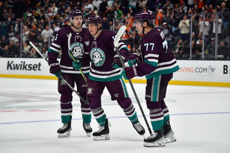 Nov 24, 2023; Anaheim, California, USA; Anaheim Ducks defenseman Urho Vaakanainen (5) center Ryan Strome (16) and right wing Frank Vatrano (77) celebrate the goal scored by defenseman Radko Gudas (7) against the Los Angeles Kings during the second period at Honda Center. Mandatory Credit: Gary A. Vasquez-USA TODAY Sports