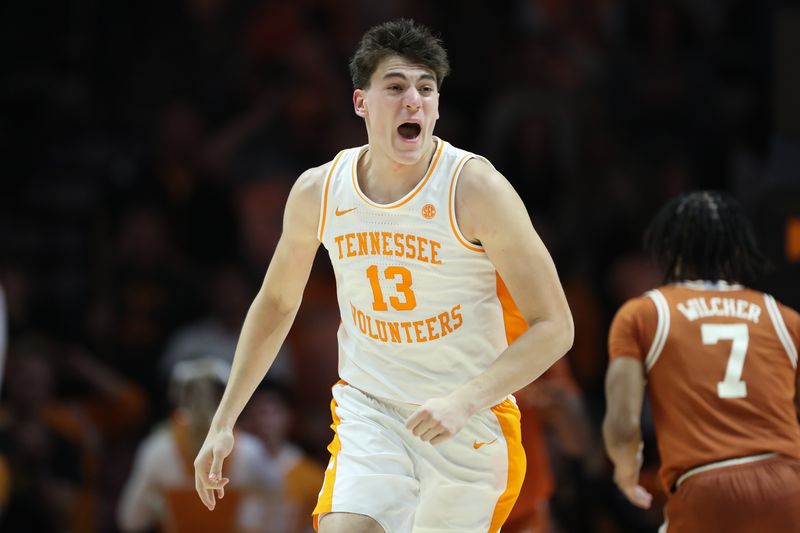Jan 6, 2026; Knoxville, Tennessee, USA;  Tennessee Volunteers forward J.P. Estrella (13) reacts to a play against the Texas Longhorns during the second half at Thompson-Boling Arena at Food City Center. Mandatory Credit: Randy Sartin-Imagn Images