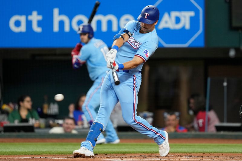 Aug 20, 2023; Arlington, Texas, USA; Texas Rangers first baseman Nathaniel Lowe (30) singles against the Milwaukee Brewers during the first inning at Globe Life Field. Mandatory Credit: Jim Cowsert-USA TODAY Sports