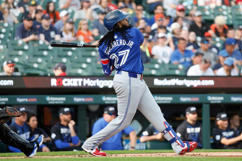 May 24, 2024; Detroit, Michigan, USA; Toronto Blue Jays first baseman Vladimir Guerrero Jr. (27) hits a double in the first inning against the Detroit Tigers at Comerica Park. Mandatory Credit: Brian Bradshaw Sevald-USA TODAY Sports