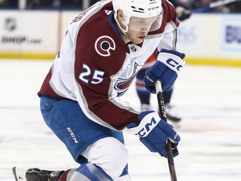 Jan 26, 2025; New York, New York, USA;  Colorado Avalanche right wing Logan O'Connor (25) controls the puck in the third period against the New York Rangers at Madison Square Garden. Mandatory Credit: Wendell Cruz-Imagn Images